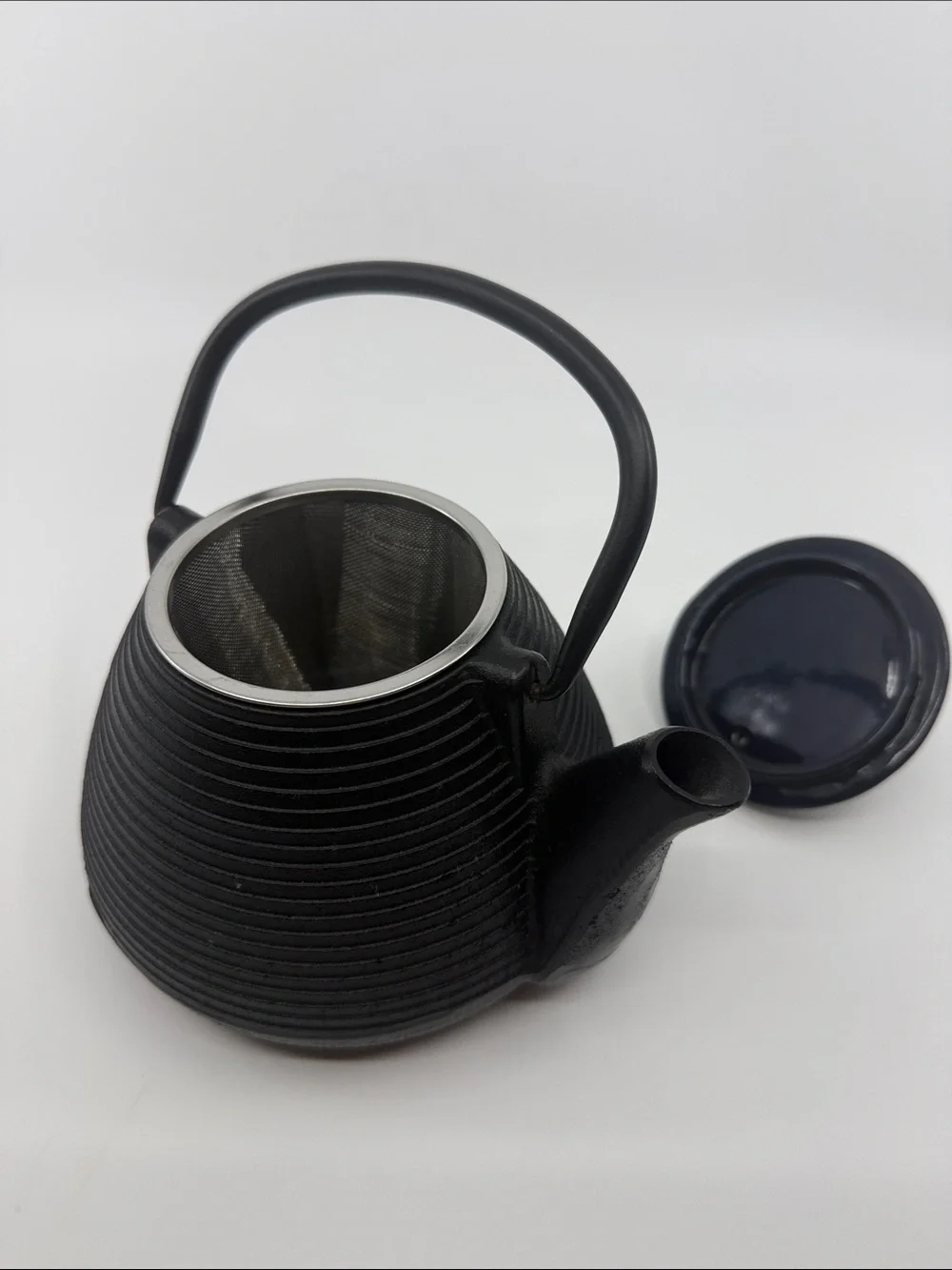 Elegant Black Cast Iron Teapot with Textured Finish